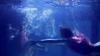 Lilia Mihalkova and Natalia Kupalka dive underwater for steamy teen lesbian pool play