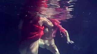 Lilia Mihalkova and Natalia Kupalka dive underwater for steamy teen lesbian pool play
