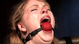 strapped brunette sub gagged and bound rides sybian machine in intense bdsm session