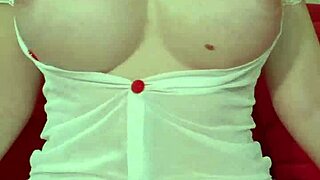 A pretty blonde in see-through dress teases with her huge bouncing tits up close homemade