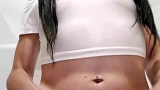 Emy Angel's soaked t-shirt clings to her teasing curves