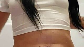 Emy Angel's soaked t-shirt clings to her teasing curves