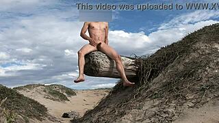 she teases her cock nude at the beach then cums in public plaza