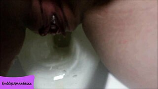 My shaved pierced pussy pees in the bathroom toilet