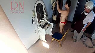 Hidden camera watches barber make nude lady undress for haircut session.