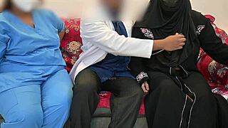 doctor plays with patient as nurse watches in hospital