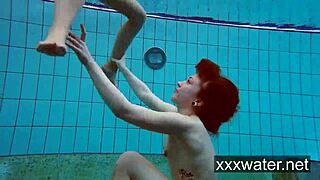 Milana and Katrin rip bikinis stripping nude underwater at beach pool.