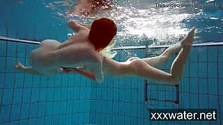 Milana and Katrin rip bikinis stripping nude underwater at beach pool.