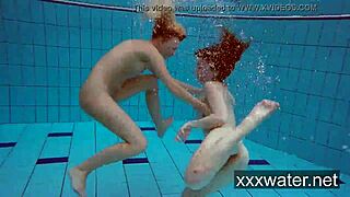 Milana and Katrin rip bikinis stripping nude underwater at beach pool.