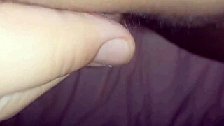 a young woman teases her big wet pussy close up