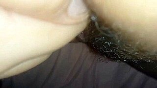 a young woman teases her big wet pussy close up