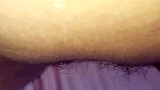 a young woman teases her big wet pussy close up