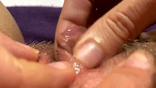 her swollen big clit throbs wildly to orgasm in tight closeup view