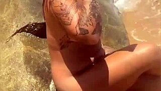 Young exhibitionist strips naked on african beach for thrills