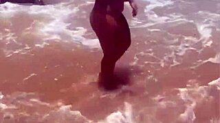 Young exhibitionist strips naked on african beach for thrills