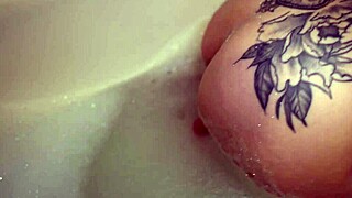 sexy tattooed teen bitch grabs huge rubber dildo and masturbates her wet tight pussy passionately in bathroom