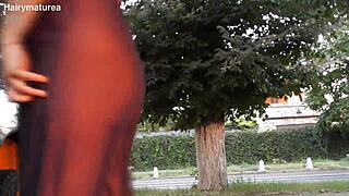 Hairy mature beaver flashes chubby pussy see-through outdoors