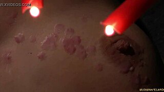 Redhead bound in latex spasms from wax on pussy in outdoor bdsm