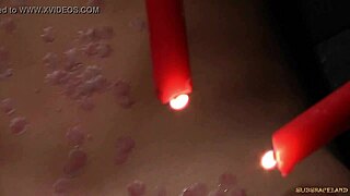 Redhead bound in latex spasms from wax on pussy in outdoor bdsm