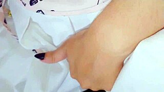 A cute girl in a white skirt and t-shirt explores tongue play and solo time.