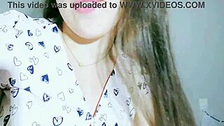 A cute girl in a white skirt and t-shirt explores tongue play and solo time.