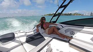 bikini babe on boat flashes huge fake tits small waist thong teasing tanned