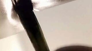 Shemale in sheer pantyhose rams dildo deep into her big ass solo