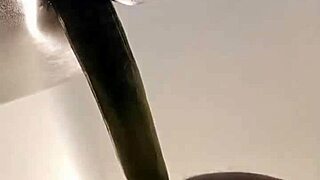 Shemale in sheer pantyhose rams dildo deep into her big ass solo