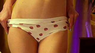 Curvy blonde teen with small waist dances moaning in strawberry panties hugging her round ass solo