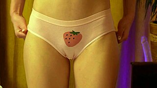 Curvy blonde teen with small waist dances moaning in strawberry panties hugging her round ass solo