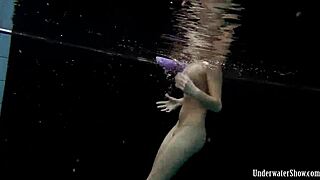 Aneta Splashes Big Tits in Purple Dress Pool Bath