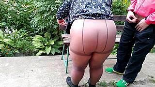 your slutty mother-in-law in pantyhose begs for my hot piss golden shower on her fat pussy outdoors