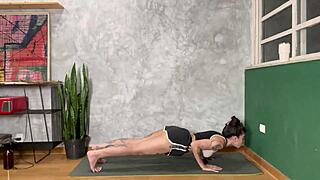 Hot tattooed girl stretches her curvy ass in home yoga class