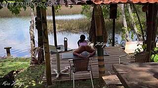 A married slut does yoga by the lake with her swimsuit wedged deep in her big pussy flashing all