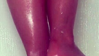 nylon feet tease and glisten under shower water in steamy bathroom display