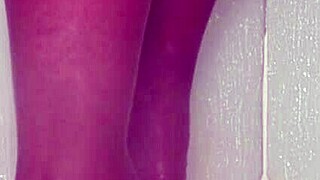 nylon feet tease and glisten under shower water in steamy bathroom display